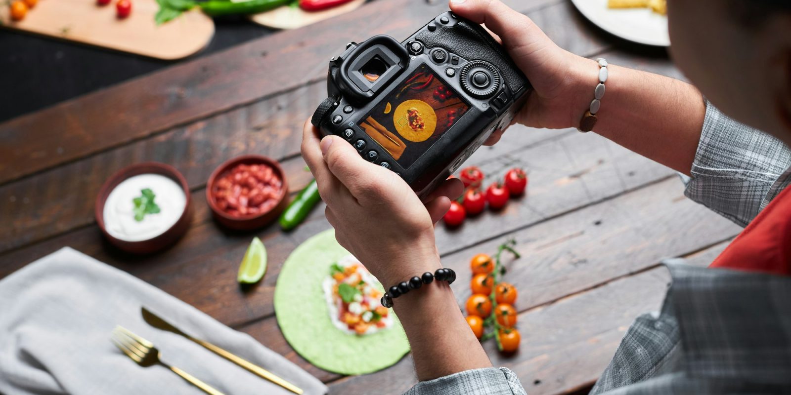 Man making photo of food on camera