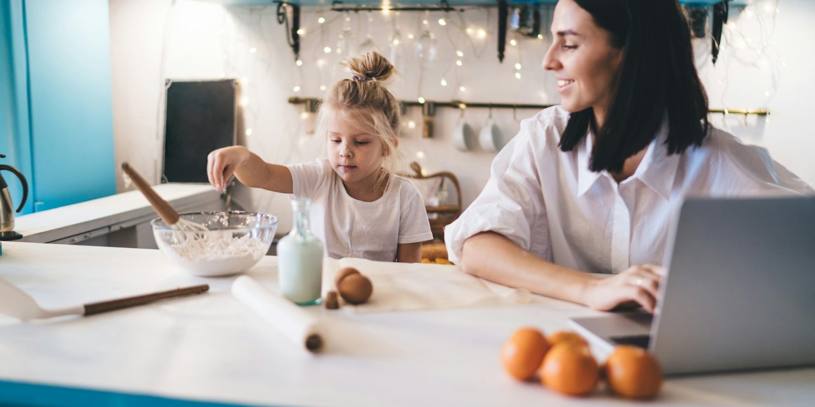 Mother and daughter cooking in kitchen