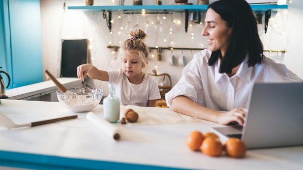 Mother and daughter cooking in kitchen