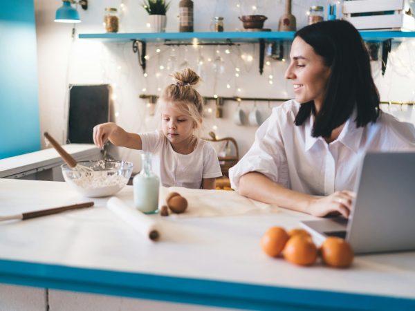 Mother and daughter cooking in kitchen