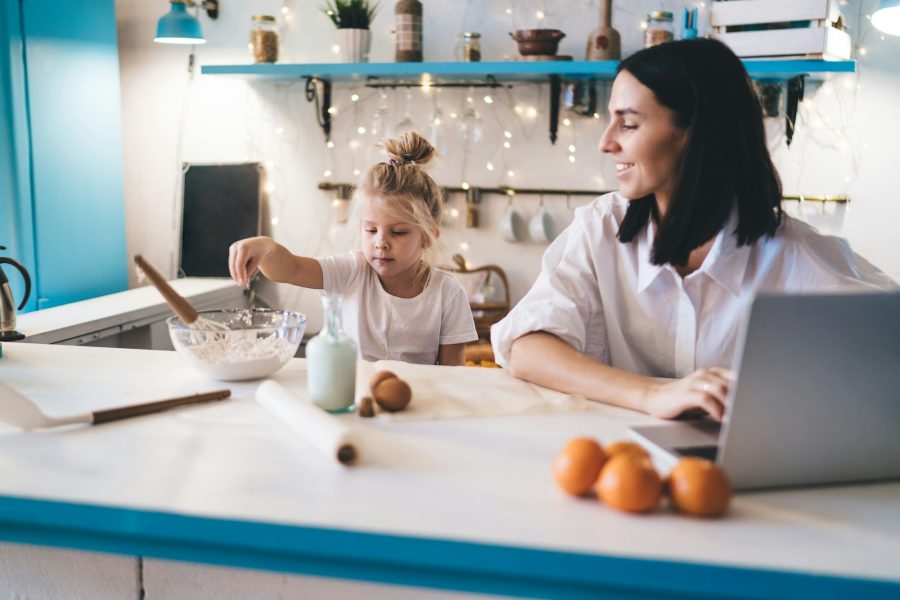 Mother and daughter cooking in kitchen